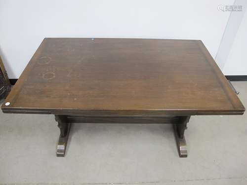 A Ercol style drawer leaf table, mahogany top, stained beech base with shaped end supports united by