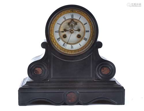 An early 20th Century black slate mantle clock, with white enamel dial, with Roman numerals in a