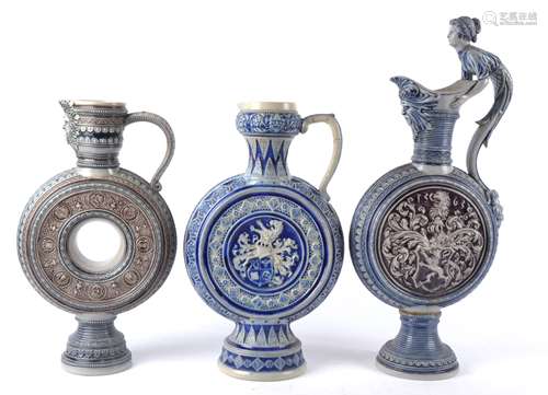 A group of seven German salt glaze stoneware ewers, probably Westerwald or Mettlach, the largest