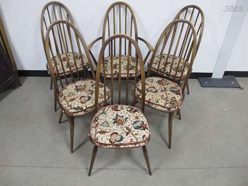 A set six Ercol Windsor Quaker chairs, five side and one carver, five with blue and gold stickers,