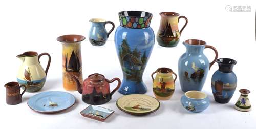 A group of Torquay Devon Ware pottery of various designs to include various pieces with designs of