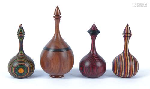 Paul Swan (Contemporary British) four turned wood objet d'art, all of ovoid form with colourised