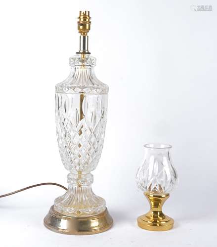 A 20th Century cut glass vessel raised on a stand marked Waterford, height 18cm, together with a