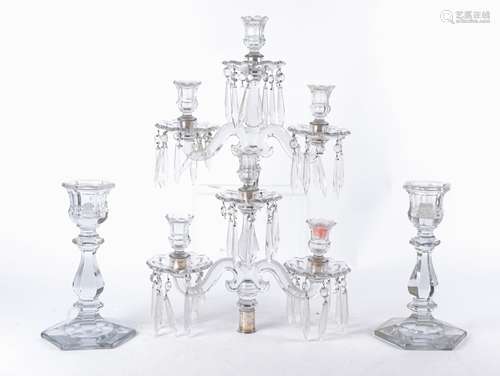 Two 20th Century twin branch glass candelabra with lustre drops, each raised on a hexagonal base,