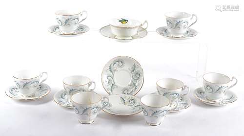 A set of eight Royal Standard tea cups and saucers, in the Garland pattern with gold gilding,