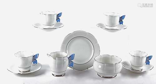 A 20th Century china tea set 'C W S Windsor China' with butterfly wing handles, consisting of