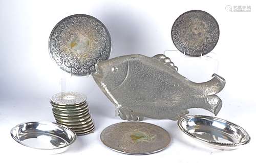 A repoussé tin tray modelled as a fish, length 48cm, together with two silver plated oval dishes and