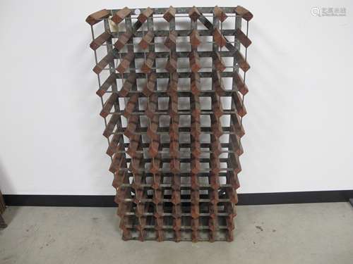 A seventy two bottle wooden and metal wine rack, 63cm x 24cm x 123cm