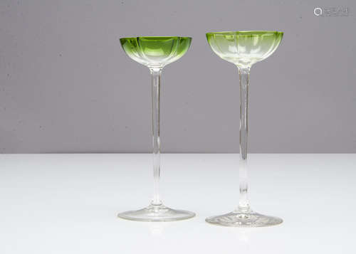 A pair of German Art Nouveau liquor glasses, the shallow quatrefoil green bowls on slender stems and