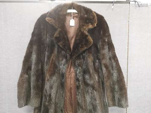 A ladies dark brown mink fur coat, with black suede panels, fitted waist with interior belt, brown