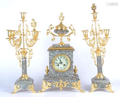 A early 20th Century French marble mantle three piece clock garniture, grey enamel dial with