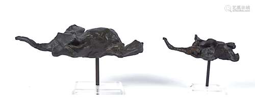 Two contemporary metal sculptures of elephants, possibly a bronze or brass structure with a black