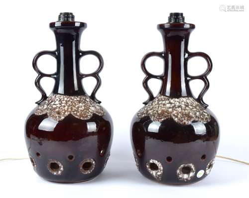 A pair of West German pottery lamp bases, with twin handles, brown glaze simulating the surface of