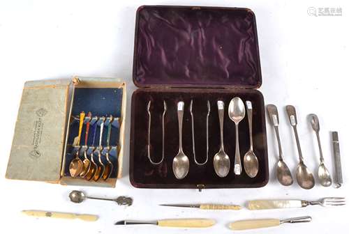 A part set of harlequin Danish enamel spoons, a George Unite mother of pearl fork, a silver