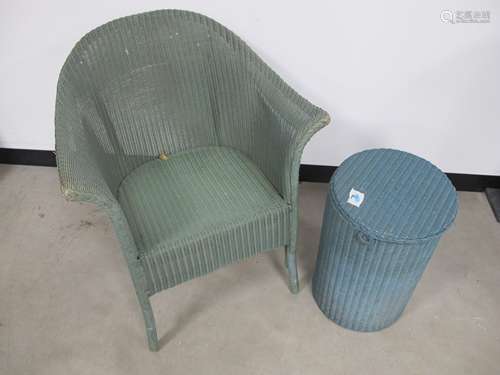 A Lloyd Loom arm chair, label to underside, sold together with a circular laundry basket