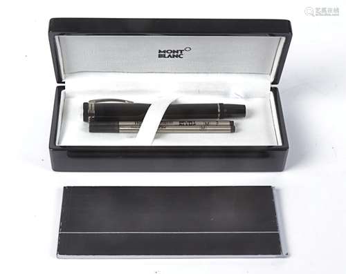 A black Mont Blanc ball point pen, in original retailers box with manual,4.5cm x 18cm x 8cm and card