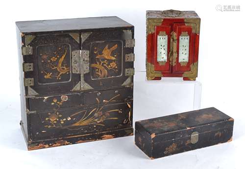 A Japanese black lacquered table top cabinet late Meiji or early Taisho period, with gilt decoration