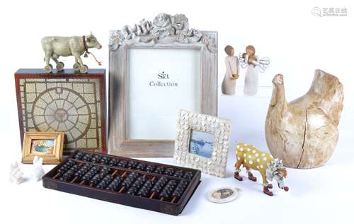 A collection of contemporary picture frames, wooden, embellished and metal examples in a variety