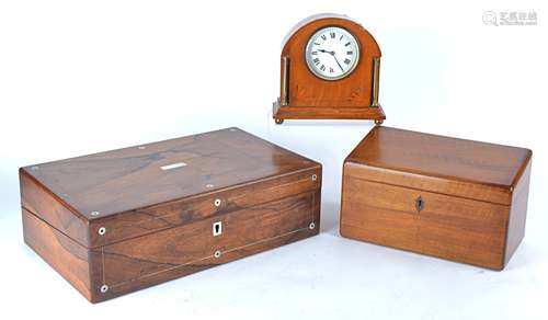 A rosewood writing slope, with mother of pearl inlays, the hinged lid enclosing a fitted interior