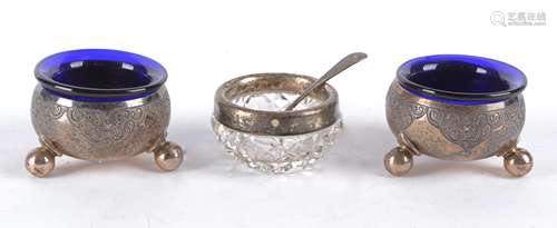 A pair of Georgian silver condiment pots, Sheffield 1878, Walker & Hall, with engraved decoration