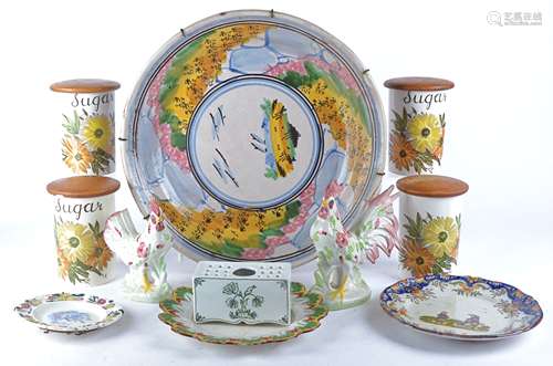 A pair of continental tin glazed earthenware dishes with central depictions of figures, diameter