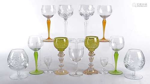 A set of four continental hook glasses, with coloured stems and engraved decoration of grapes and