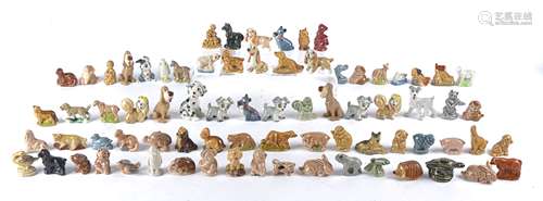 A collection of Wade Whimsie animals and Disney dogs, including Lady and the Tramp and Thumper the