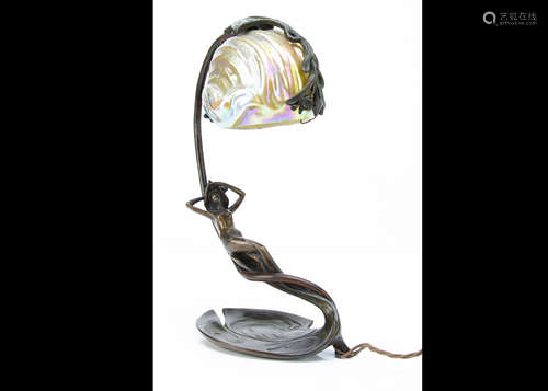 A continental Art Nouveau bronze and Loetz glass table lamp, by Claude Bonnefond, circa 1900, the