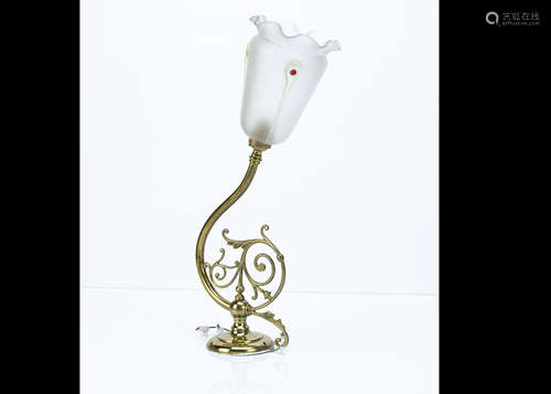 An Art Nouveau style lacquered brass mounted wall light, supporting a frosted tapered tulip style