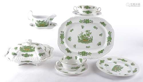 A Spode bone china part dinner service with green flowers, consisting of six dinner plates, six