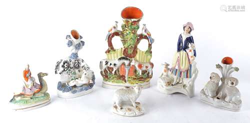 Six Victorian Staffordshire figures with animal subject matter to include an interesting example