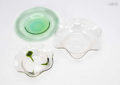 An English Art Nouveau circular dish, with applied green punts and trails also a green glass dish