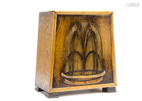 An Art Deco oak cased speaker, of triangular tapered form with pierced grill of fountain design,