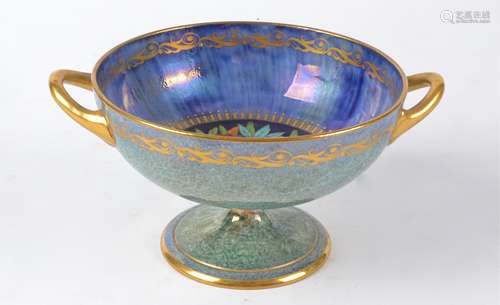 A Minton lustre twin handled comport with sponge effect and central decoration of fruits, height