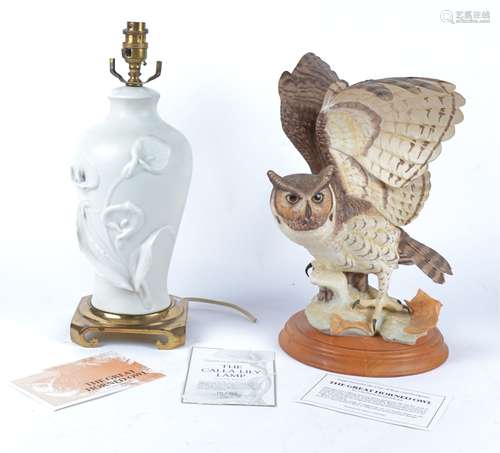 A Franklin Mint bisque porcelain sculpture of 'The Great Horned Owl', raised on a circular wooden