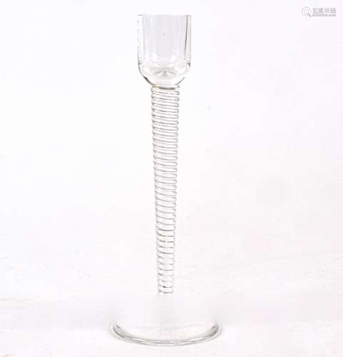 A St Louis glass candlestick with twisted stem, the base with printed St Louis France back stamp,