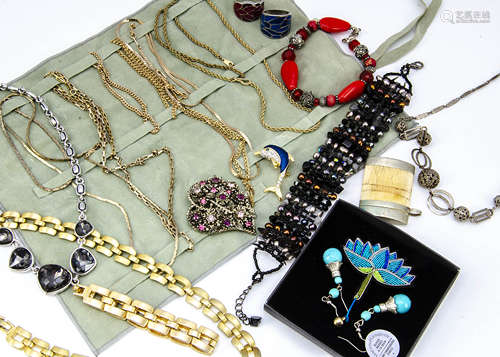 A large collection of costume jewellery including a black bead and read fringe necklace, various