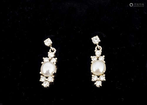 A pair of cultured pearl and diamond drop ear studs, the half cut pearl set with trefoil diamond