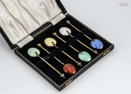 A cased set of six 1950s silver gilt and enamelled coffee spoons from Adie Bros