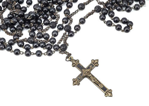 An early 20th Century ebony, brass and base metal extra long rosary, with engraved mother and