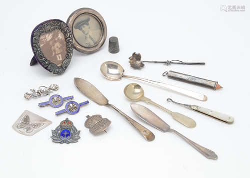 A small group of silver and silver plate and other items, including a silver ARP badge, a silver and