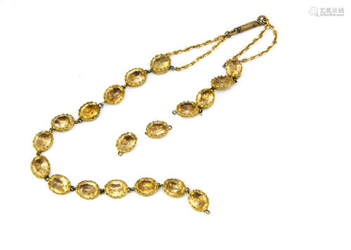 A foil backed paste set necklace, the oval mixed cut citrine coloured stones in claw settings in