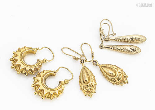 Three pairs of 9ct gold earrings, including two pairs of drops, one with floral decoration, and a