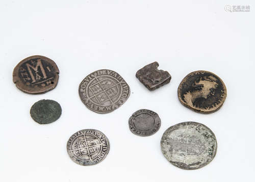 A collection of ancient and antique coins, including several Roman examples, a rectangular Celtic