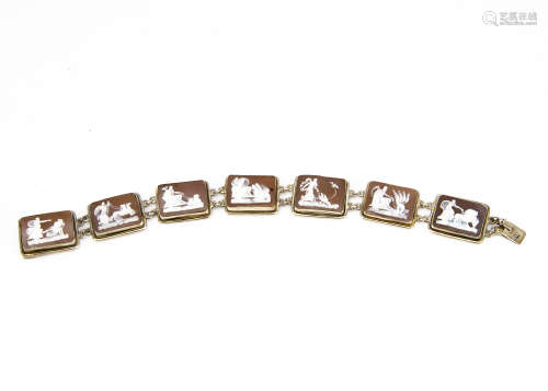 An early 20th Century continental shell carved cameo bracelet, the seven rectangular panels all