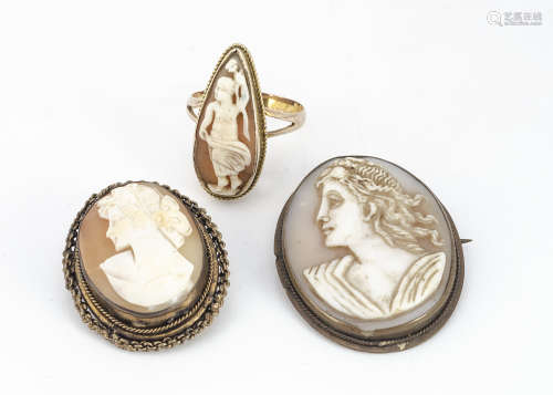 A 19th Century shell cameo gold dress ring, with carved panel of a nude female holding a flower