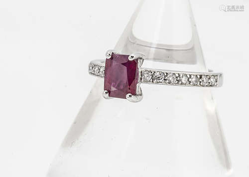 A ruby and diamond white 18ct gold dress ring, the mixed rectangular cut ruby in four claw setting