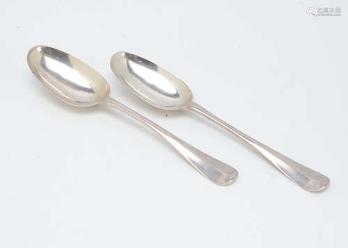 A pair of George II style white metal tablespoons, each with rat tail to bowl and bearing strike