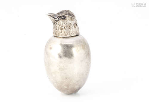 A George V silver miniature novelty scent bottle, modelled as a chick emerging from an egg,