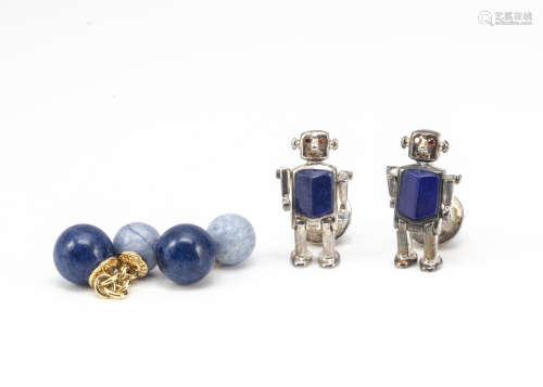 A pair of silver Thomas Pink cufflinks, modelled as robots with articulated arms and legs, lapis